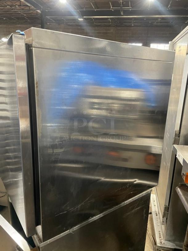 Traulsen UHT27L commercial stainless steel undercounter refrigerator, electric powered, with poly-coated wire rack.