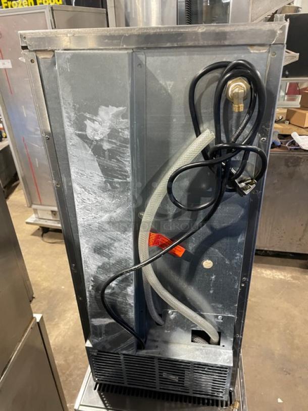 Hoshizaki AM-50BAE-AD undercounter ice machine, stainless steel, electric-powered, visible wiring, used condition.