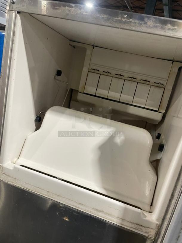 Hoshizaki AM-50BAE-AD ice maker interior view, stainless steel, electric, 115-120V, undercounter model in used condition.