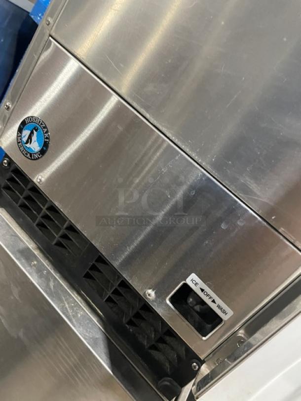 Hoshizaki AM50BAEAD undercounter ice machine, stainless steel, electric, model and serial number visible, clean condition.