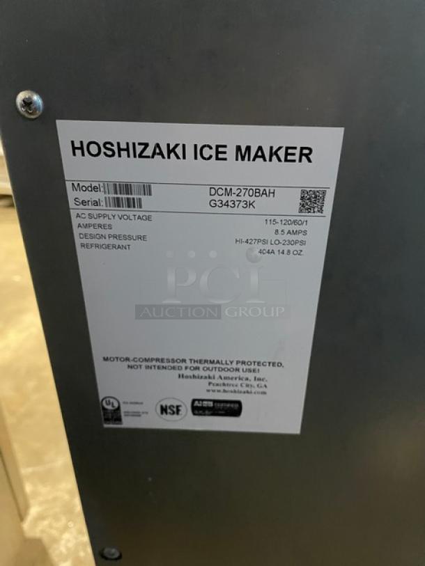 Hoshizaki DCM-270BAH stainless steel ice maker with drip tray, model details on label: 115-120V, 1 phase, SN: G34373K. 