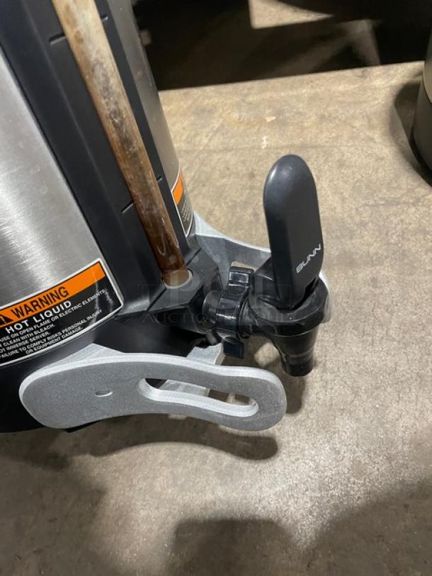 Bunn SHSERVER stainless steel insulated coffee server, commercial-grade, with spout and warning label visible. Serial: TS00584152.