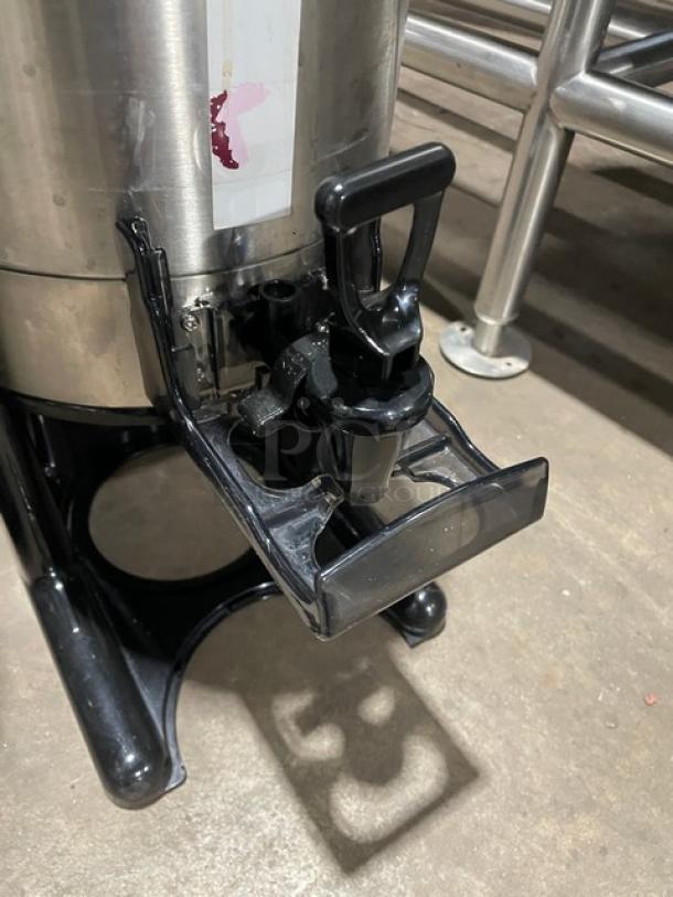 Bunn/Curtis commercial stainless steel coffee server with insulated design. Features a black plastic spout and base.