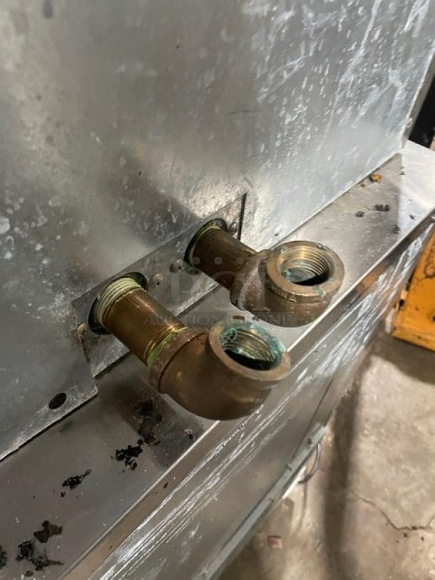 Hoshizaki DCM-500BAF ice/water machine back view, showing two metal pipe connections. 115-120V, commercial-grade.