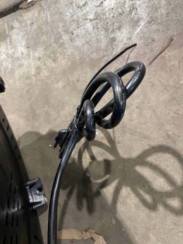 Aroma ARC-1130S commercial stainless steel countertop rice cooker, electric-powered, with coiled power cord, model label visible.