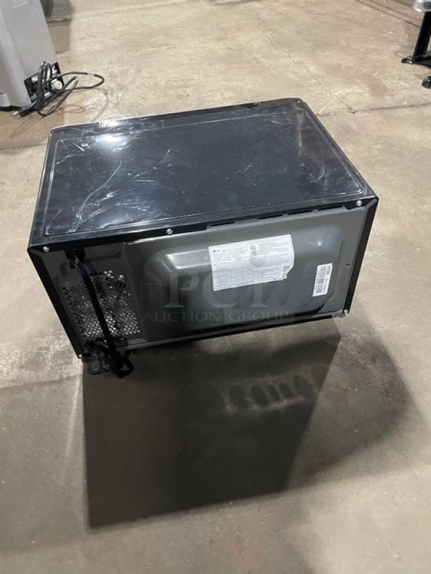 LG model LCS1112ST stainless steel countertop microwave, digital control, good condition, 120V, 1 phase, rear view.