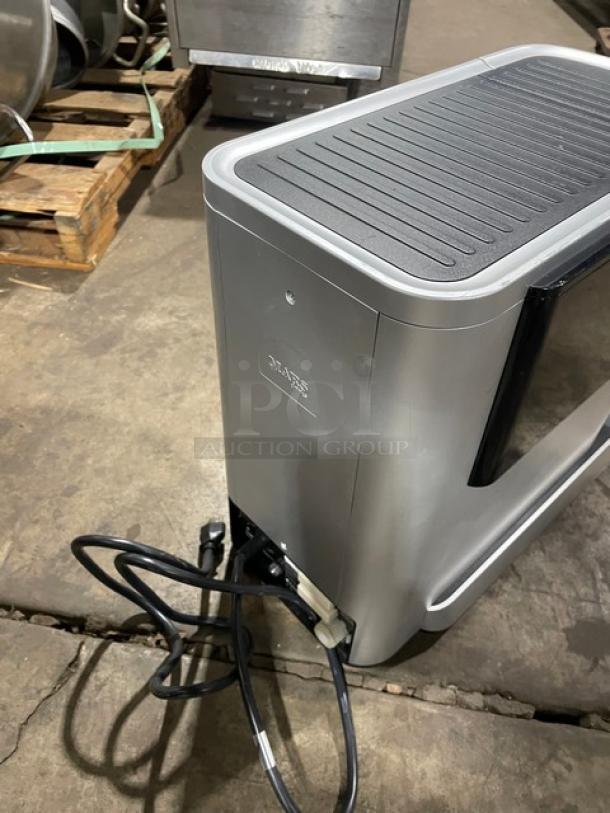 Mars! 2025 commercial black electric countertop coffee machine with drip tray. Features power cord and side controls.