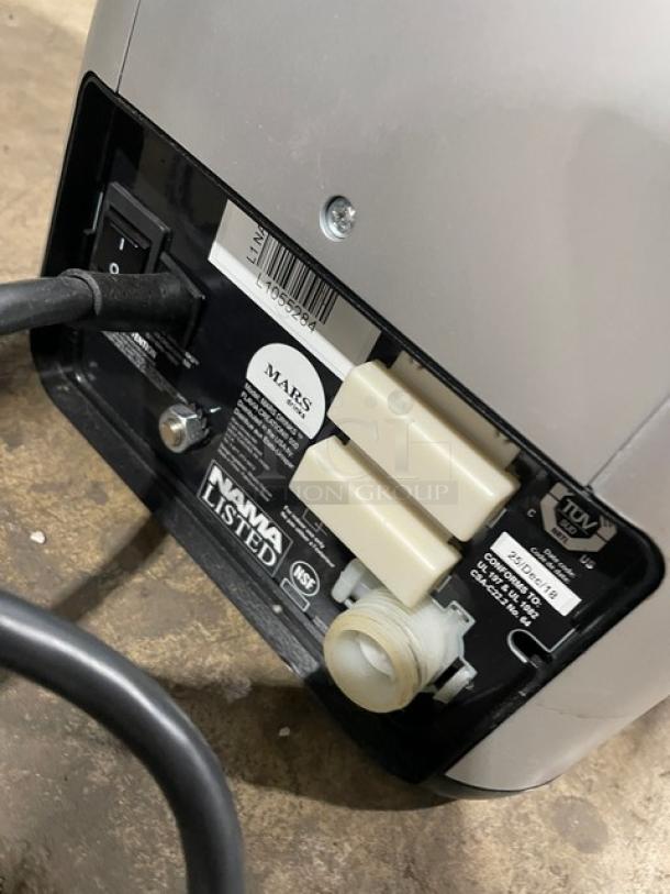 Mars 2025 black commercial electric coffee machine base, showing power cord, switch, and safety certifications.