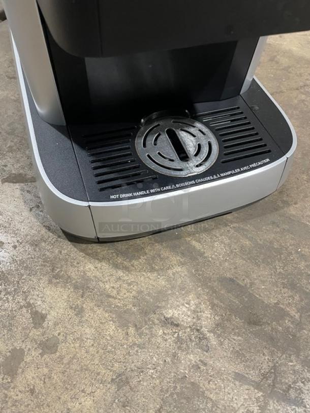 Mars 2025 commercial black electric countertop coffee machine with drip tray, excellent condition, warning label visible.