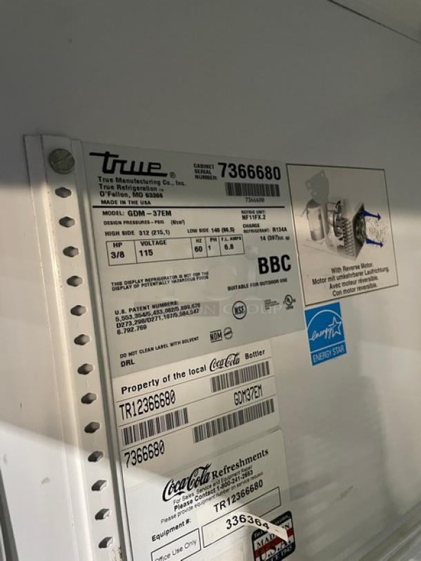 True GDM37EM double glass sliding door merchandiser label, featuring model, serial number 7366680, and Energy Star certification.