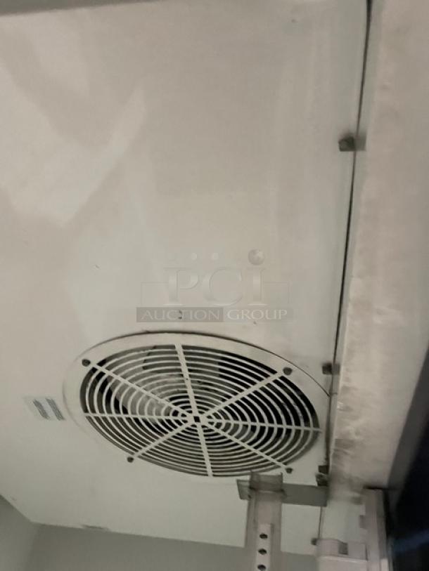 True GDM-45 commercial refrigerator with double glass sliding doors, poly coated wire rack, 115V, 1 phase. Model SN: 1-4346347.