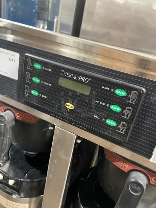 Curtis ThermoPro TP2T16A3100 stainless steel twin coffee brewer with hot water dispenser, insulated servers, and control panel.