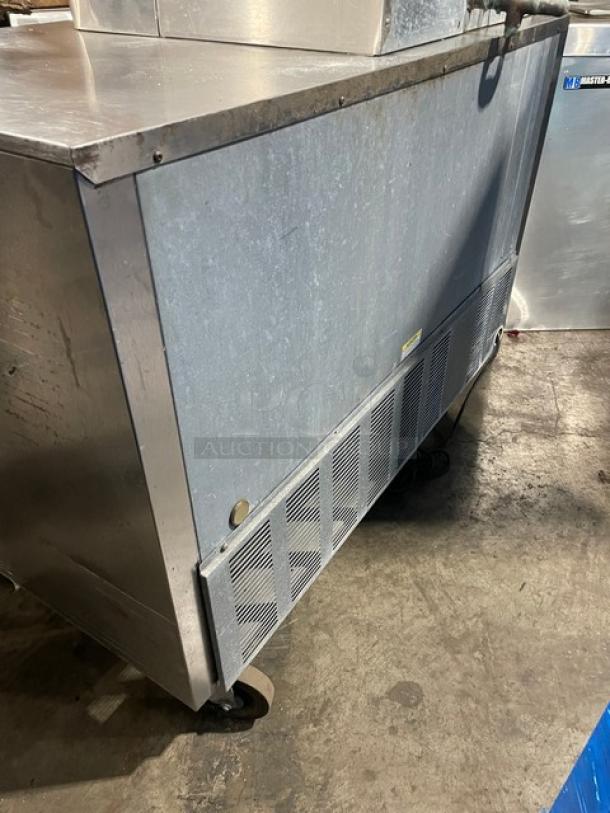 Beverage-Air UCR48A stainless steel 2-door undercounter refrigerator on casters, featuring a poly coated wire rack.