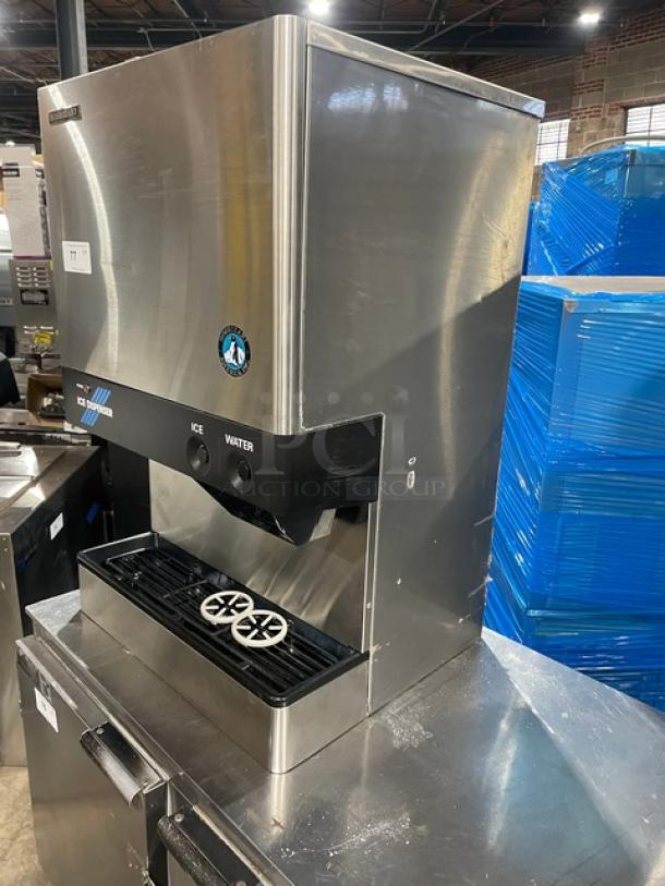 Hoshizaki DCM-500BWF stainless steel ice maker and water dispenser, electric-powered, countertop model with drip tray.