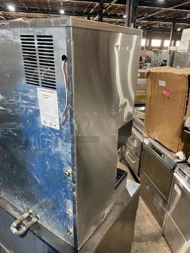 Hoshizaki DCM-500BWF stainless steel ice maker, water-cooled, with drip tray. Model: DCM-500BWF, SN: P01238H, 115-120V 1 Phase. Signs of use visible.