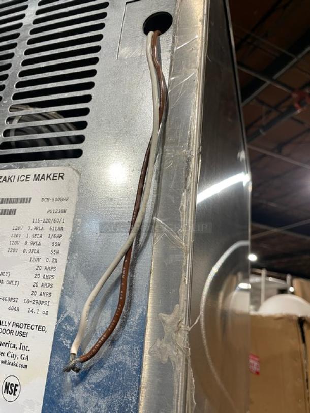 Hoshizaki DCM-500BWF stainless steel ice maker and water dispenser, electric, water-cooled, with drip tray, 115-120V, label visible.