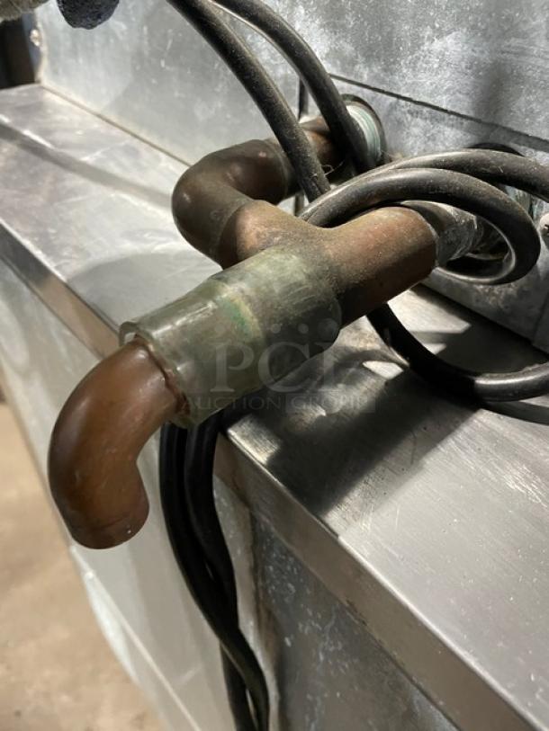 Hoshizaki DCM-500BAF ice maker pipe connections, showing metal and wiring details. Model: DCM-500BAF SN: J00513D.