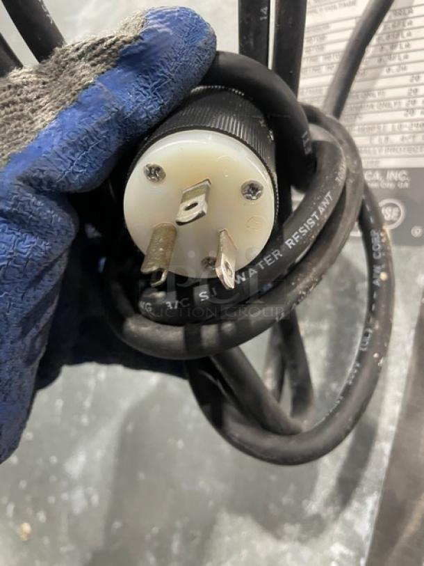 Hoshizaki DCM-500BAF ice maker plug with water-resistant marking. Model tag in background.