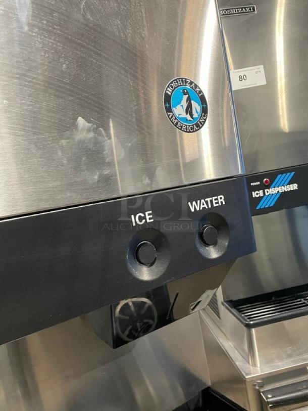 Hoshizaki DCM-500BAF stainless steel ice and water dispenser, countertop model, includes drip tray, two push-button controls.