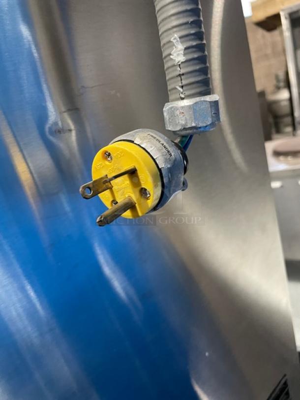 Hoshizaki DCM-500BAF ice maker power cord and plug, stainless steel body, model and serial number visible.