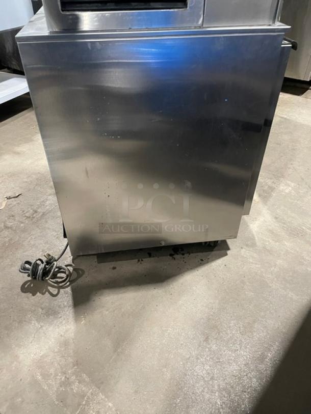 Beverage-Air UCR27 stainless steel undercounter refrigerator on casters, with poly-coated rack. Model: UCR27, SN: 8209666.