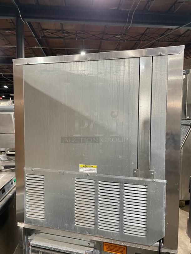 Beverage-Air UCR27Y stainless steel undercounter refrigerator, single door, shallow-depth, on casters, with poly-coated rack.