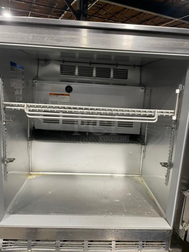 Beverage-Air UCR27Y stainless steel undercounter refrigerator, single door, poly-coated rack, on casters, 115V, model SN: 7903537.