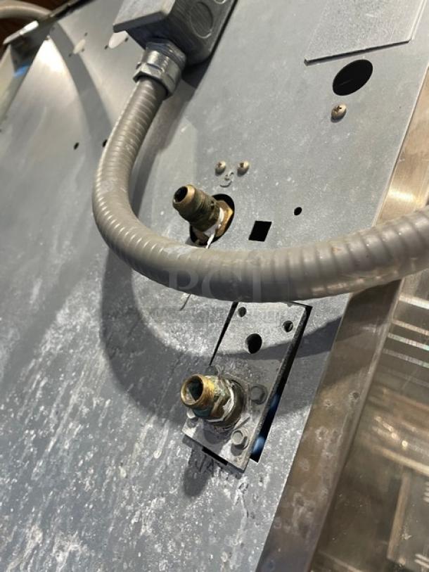 Scotsman Prodigy Series stainless steel commercial ice machine, model C1030SW-32B/BH900S-C, showcasing water connections.