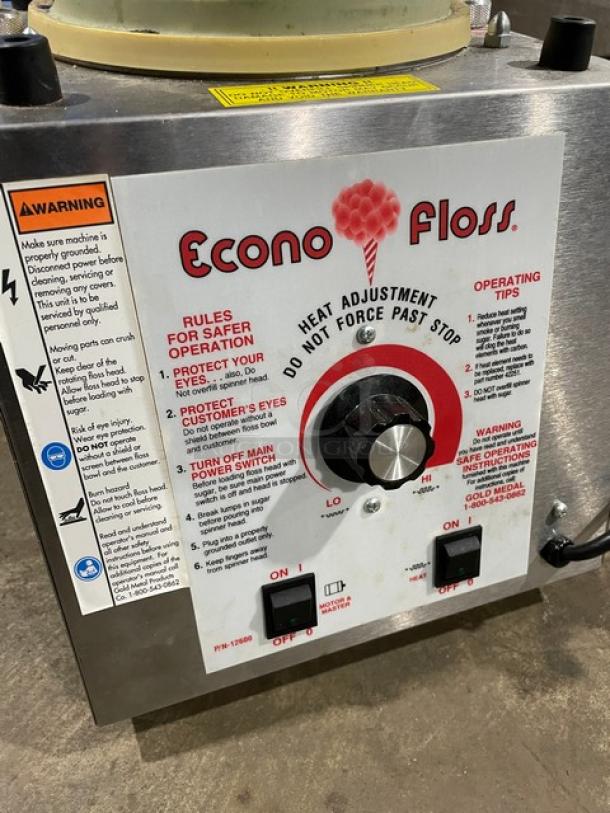 Gold Medal Econo Floss 3017SS cotton candy machine with stainless steel body, adjustable heat dial, and safety instructions. 120V.