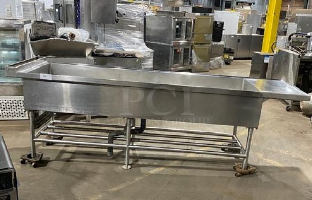 Commercial stainless steel single-well extra-large ice bin with right side drain board, on legs. Ideal for cocktail stations.