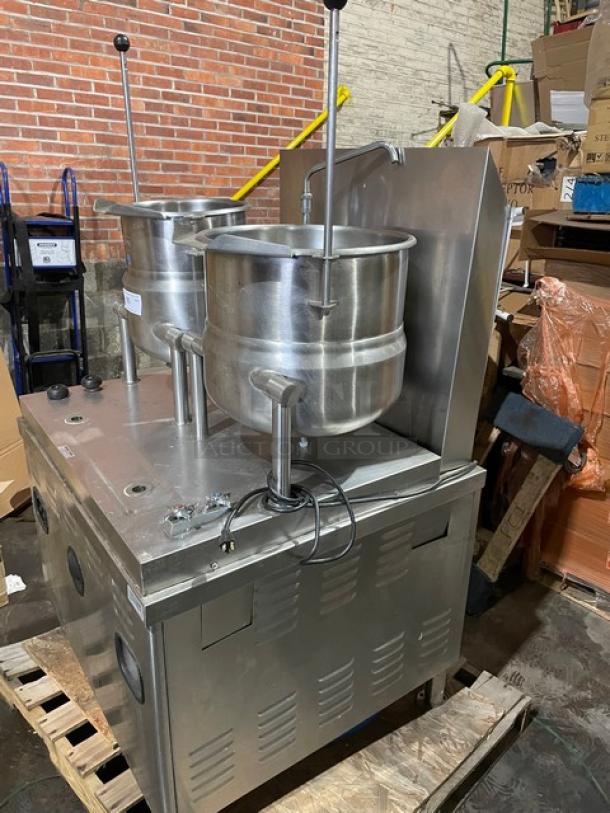 Market Forge commercial stainless steel double tilting soup kettle, natural gas, self-contained, on legs, working condition.
