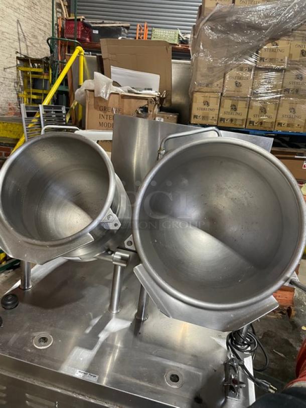 Market Forge stainless steel double tilting soup kettle, natural gas, self-contained, on legs, used, good condition.