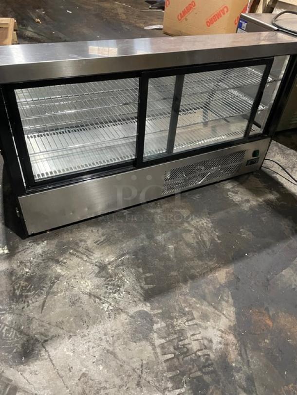 Marchia MDC201 commercial black curved glass 48" refrigerated display case with wired racks, excellent condition.