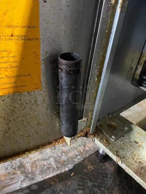 Vulcan Veg Series commercial deep fat fryer, model 1VEG50M-1, stainless steel, natural gas powered, with backsplash and basket hanger, visible wear.