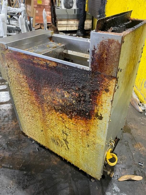 Frymaster PMJ135SD commercial deep fryer, stainless steel, natural gas, with backsplash, on casters, evident wear.