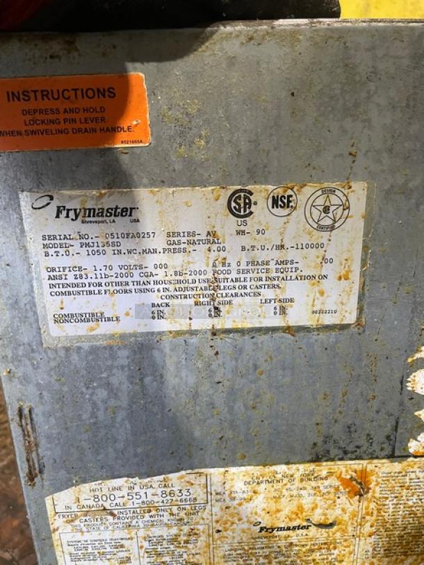 Frymaster PMJ135SD commercial stainless steel natural gas deep fat fryer on casters, with backsplash, SN: 0510FA0257.