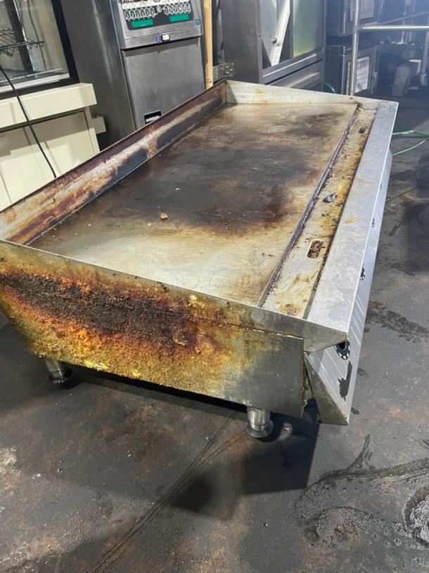 Star Ultra Max Series commercial flat griddle, stainless steel, natural gas, on legs, visible wear, used condition.
