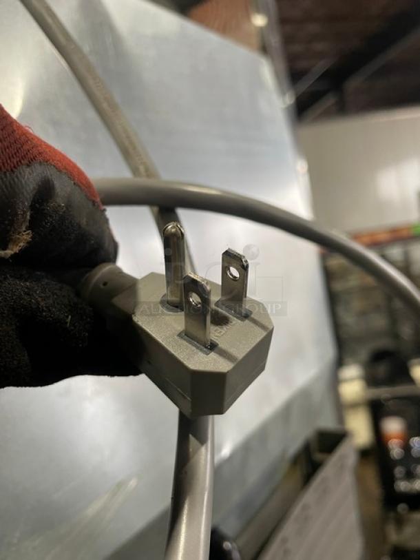 Close-up of a three-prong plug for Turbo Air M3 Series freezer, model M3F24-1, highlighting electrical compatibility.