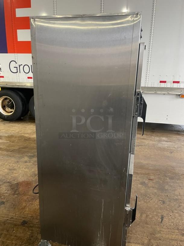 Alto Shaam 1000-UP stainless steel dual compartment heated cabinet, mobile with casters, electric powered, good condition.