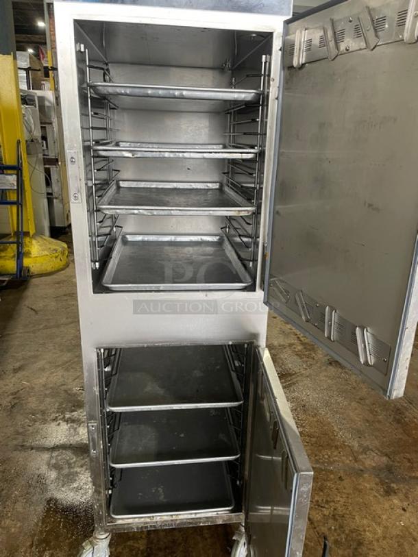 Alto Shaam Halo-Heat Series Model 1000UP dual compartment heated cabinet, stainless steel, on casters, with multiple trays.