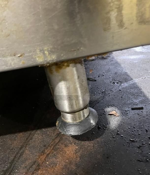 Star Ultra Max Series stainless steel natural gas flat griddle, commercial use, shown with adjustable leg, slightly worn.