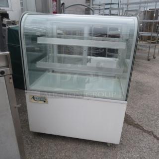 Avantco curved glass dry bakery display case on casters, model 193BCD36W, 36x26.5x48 inches, working condition.