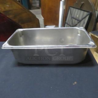 1/3 size, 4-inch deep stainless steel hotel pan. Good condition, durable for foodservice use, no visible markings.