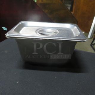 1/9 Size 6-inch deep stainless steel hotel pan with lid, used condition. Ideal for commercial kitchen use.