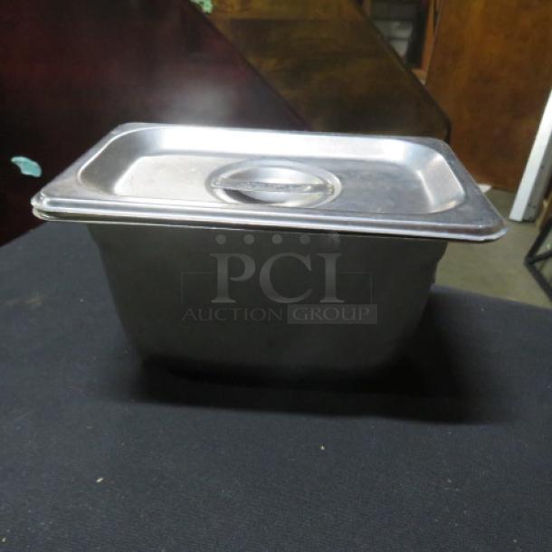 1/9 Size 6-Inch Deep Hotel Pan with Lid, stainless steel, used condition, features secure-fitting lid.