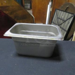 1/9 size 4-inch deep hotel pan, good condition, stainless steel, durable construction, essential for kitchen use.