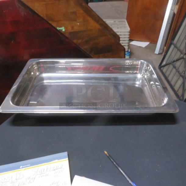 New full-size 2.5-inch hotel pan, stainless steel, pristine condition, ideal for food service use.
