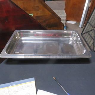 New full-size 2.5-inch hotel pan, stainless steel, pristine condition, ideal for food service use.