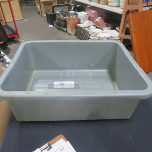 Gray bussing tub, rectangular, used condition with visible scratches. Label marked "96" on the side.