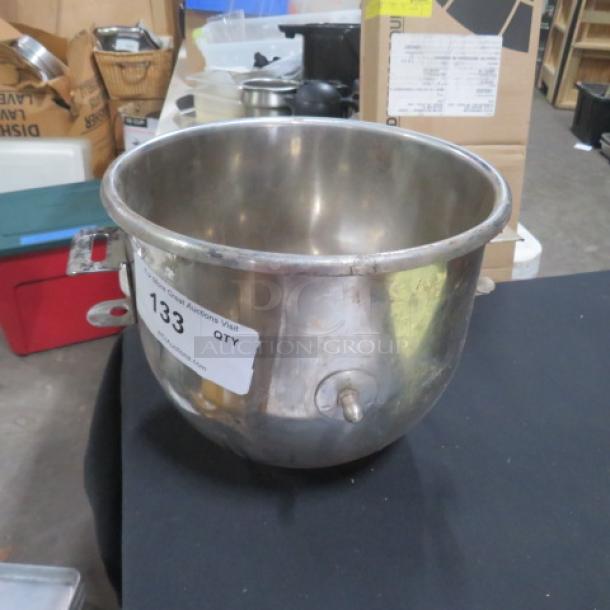 Stainless steel 20-quart mixing bowl, with visible handle and label. Auction tag indicates item 133. Used condition.